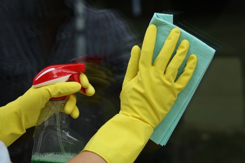 Professional cleaners maintaining a workplace washroom in SW7