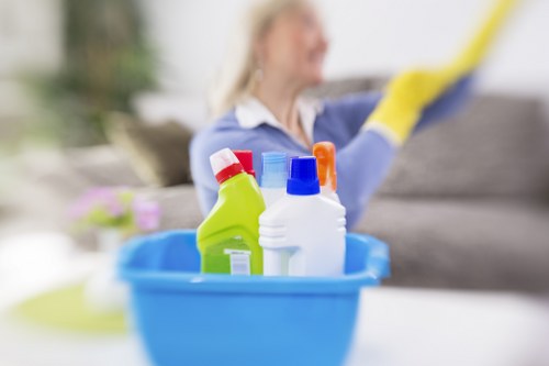 Technician carrying out fabric upholstery cleaning in SW7